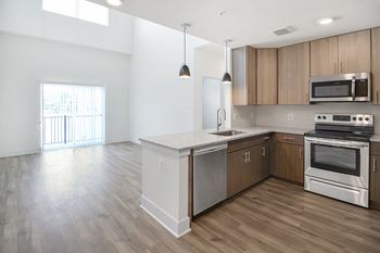 a kitchen and living room in a 555 waverly unit
